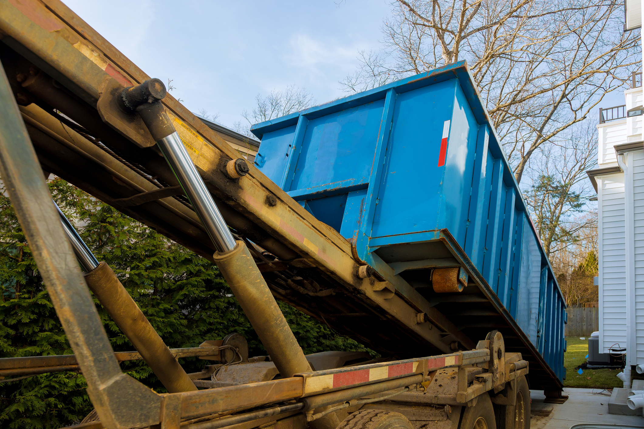 Unloading empty dumpster